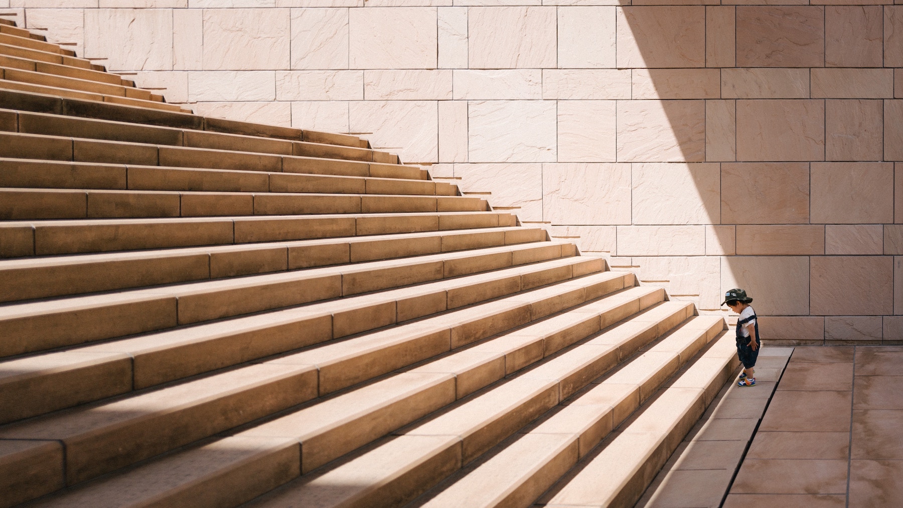 toddler stares at staircase 